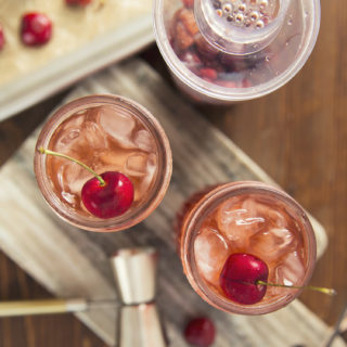 This week's happy hour at home begs you to make this seasonal Cherry Bourbon Smash Cocktail recipe. Fresh, tart cherries pair beautifully with quality bourbon for this crowd-pleasing drink.