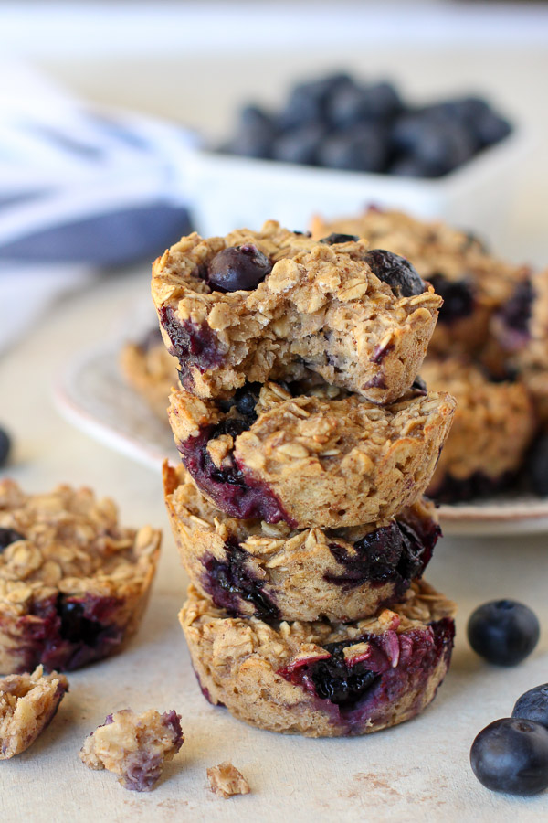 Quick and easy baked Blueberry Banana Oatmeal Cups are the perfect make-ahead breakfast for busy mornings. Filled with oats, maple syrup, almond butter, mashed banana, and blueberries, there's nothing not to love!