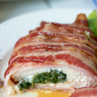 You are going to love this delicious Bacon Wrapped Stuffed Chicken Breasts recipe full of fresh spinach and white cheddar cheese. Cooking for two just got a lot more delightful!