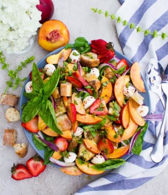 This Basil Peach Panzanella Salad is what farmers markets were made for! A tuscan salad with a twist, this simple, 20-minute recipe uses seasonal fruits and vegetables to create an international dish that's the perfect lunch, dinner side, or outdoor potluck.