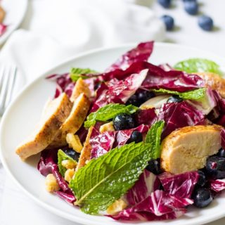 What's not to love about this farmers market Swedish Grilled Chicken Radicchio Salad? A light weeknight meal with fresh ingredients topped with maple syrup vinaigrette. Meal prep the grilled chicken ahead of time for delicious lunches all week long.