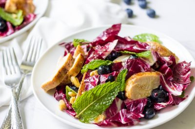 What's not to love about this farmers market Swedish Grilled Chicken Radicchio Salad? A light weeknight meal with fresh ingredients topped with maple syrup vinaigrette. Meal prep the grilled chicken ahead of time for delicious lunches all week long.