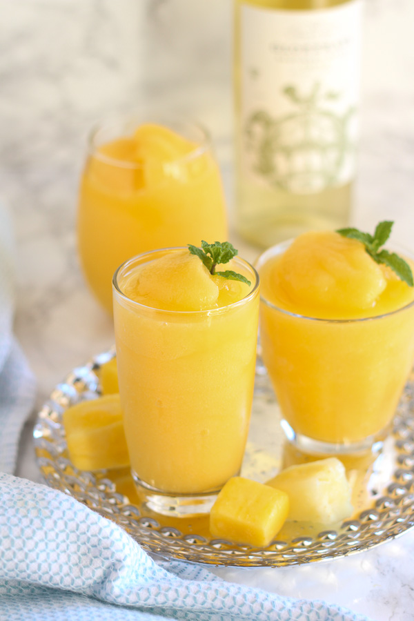 Beat the summer heat and relax poolside with friends this weekend sipping one of these five Wine Slushie Recipes made with your favorite wine and fruits.