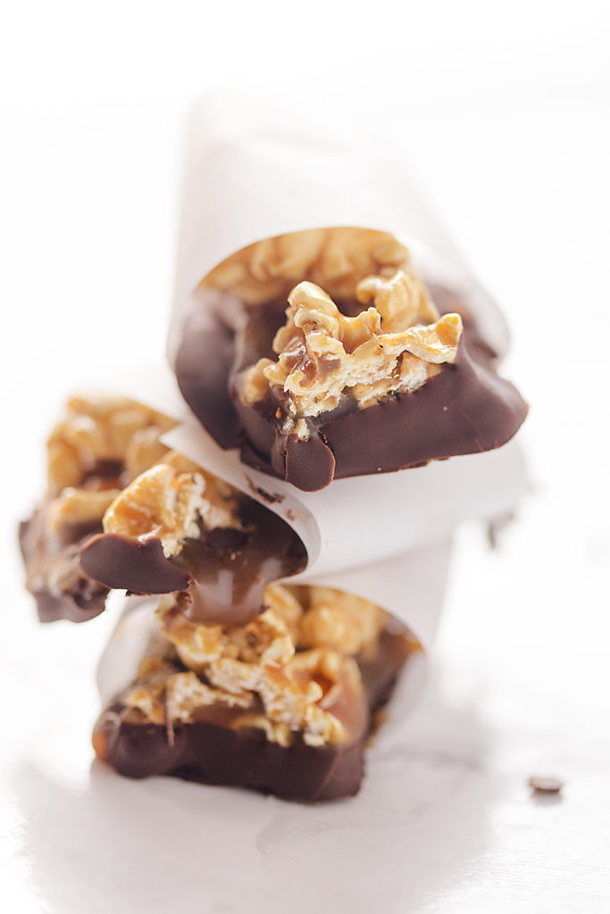 Who doesn't love caramel-covered popcorn dipped in chocolate? These gluten-free Chocolate Caramel Popcorn Bars are decadent small bites that deliver a sweet and salty combo with every mouthful.