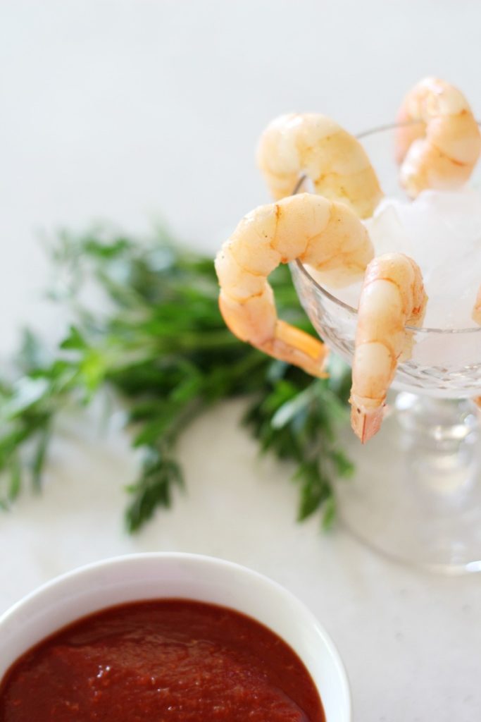 You will be all set for entertaining company once you whip up the best Spicy Garlic Shrimp Cocktail with a simple Two-Ingredient Cocktail Sauce recipe!