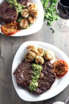 No matter the occasion, this Surf and Turf for Two is the recipe you must make for your someone special. How can you go wrong with Grilled Steak, scallops, wine, candlelight, and a bright and spicy Cilantro Chimichurri?