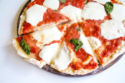 It will feel like you are taking a stroll through Italy when you taste this authentic Italian Margherita Pizza made with a handful of simple ingredients.