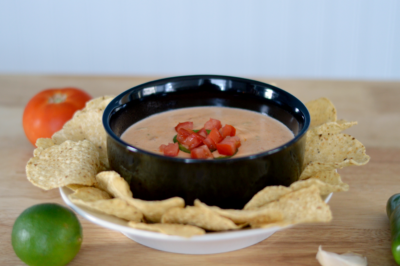 Go for the win when you tailgate with this spicy Garden Fresh Goat Cheese Queso Dip recipe. Goat cheese with tomatoes, jalapeños, garlic, and a few simple ingredients in 15 minutes!