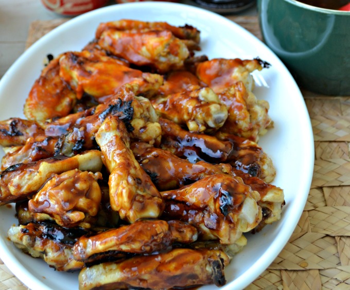 Get ready to make a mess this tailgate season with our favorite Sweet Sticky Chicken Wings Recipes. Whether you like them baked, grilled, or fried, game day will never be the same once you whip these up!
