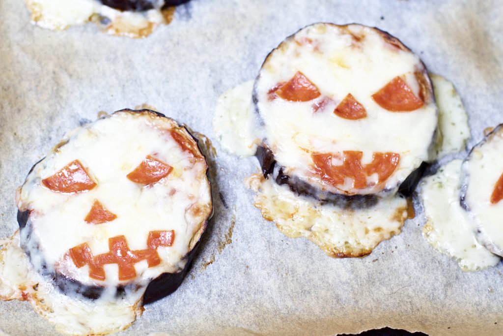 Satisfy all of the ghouls in your life this Halloween when you make these spooky Eggplant Jack-O-Lantern Mini Pizzas for your fright fest. Simple to assemble, and ready in less than 30 minutes, these are perfect for getting the little ones involved.