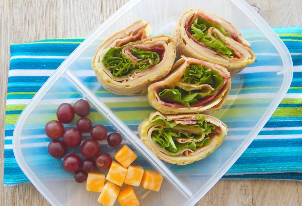 Ditch those boring ham sandwiches at lunchtime and opt for these healthy and flavorful Chipotle Chicken Guacamole Pinwheels instead. This bento box lunch will be the envy of the office!