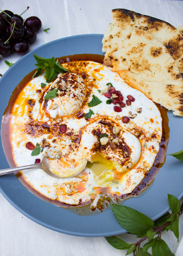 Here's a totally new way to enjoy poached eggs--creamy, smooth, buttery, and absolutely luscious Turkish Poached Eggs over Yogurt. Also known as Cilbir, this is a classic Turkish breakfast dating back to the 15th century that will tantalize your palate!