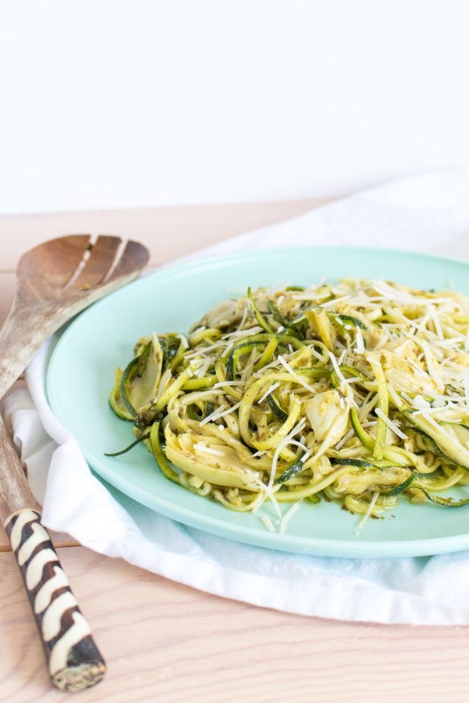 The next time you need to grab an easy lunch full of vegetables try this gluten free Artichoke Pesto Zoodle Salad made with spiralized zucchini noodles.