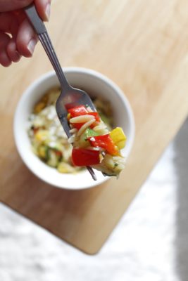 Whip up this quick and easy Roasted Vegetable Lemon Pepper Orzo recipe then add a sprinkle of feta cheese for a delectable side dish or a tasty lunch on the go!
