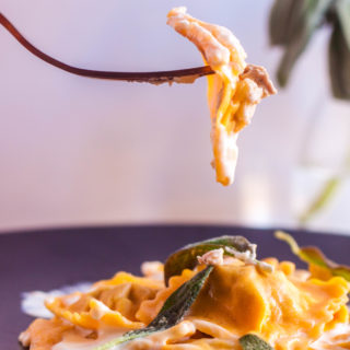 This Roasted Duck Sweet Potato Ravioli is served with a Sage Cream Sauce for a sophisticated, fall pasta dish that's sure to impress!