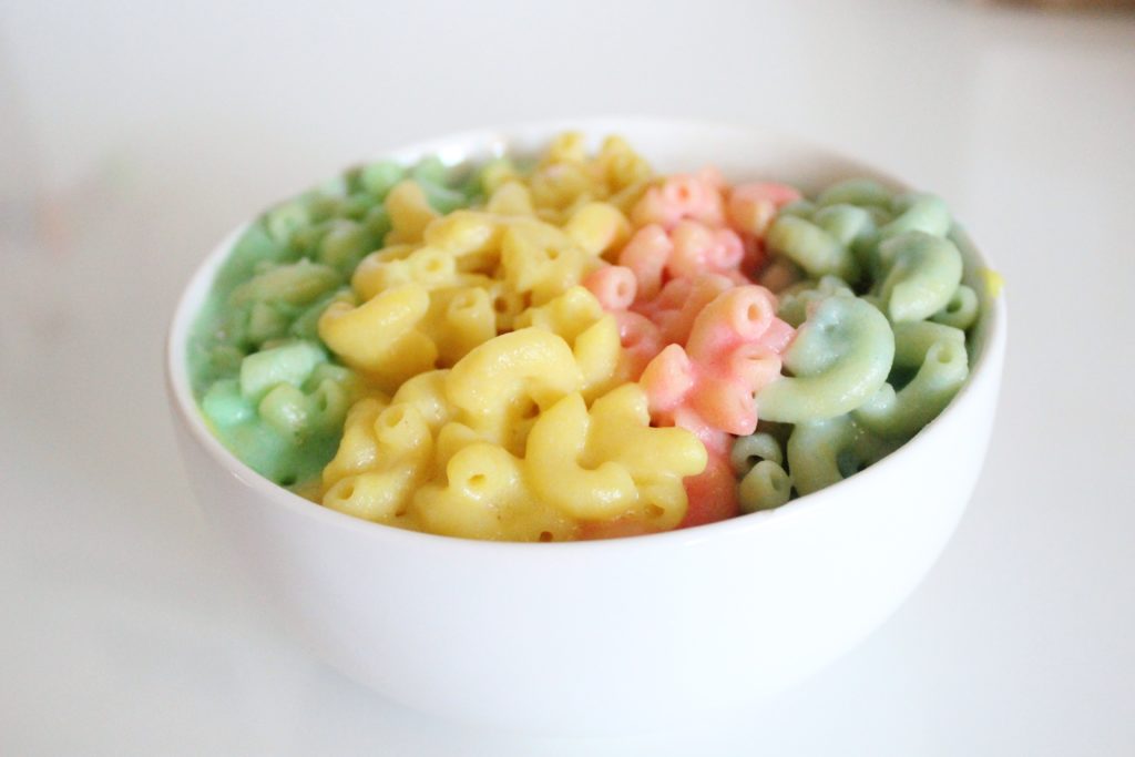 Hop aboard the magical unicorn train for dinner with this fun twist on a classic favorite. This Magical Rainbow Mac N Cheese recipe is simple to prepare and the delightful colors will impress your guests and tantalize picky eaters.