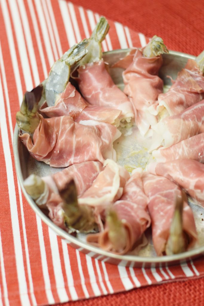 Enjoy these delightful Prosciutto-Wrapped Stuffed Shrimp Appetizer at your Feast of the Seven Fishes this year. Jumbo shrimp are stuffed with a cream cheese mixture, wrapped in prosciutto, and baked to perfection!