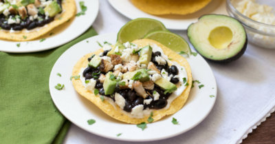 Use leftover chicken to make Chicken Black Bean Tostadas Aztecas. A cheap healthy meal perfect as an appetizer or quick 30-minute weeknight dinner.