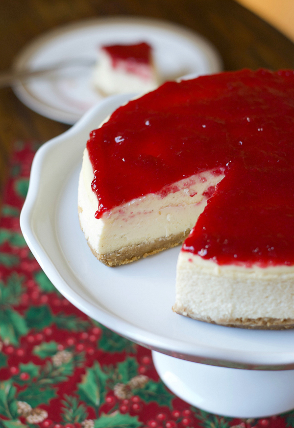 This festive Cranberry Glazed Eggnog Cheesecake recipe balances rich, creamy, and tart flavors that will simply delight your tastes buds. This holiday twist on a classic favorite will be loved by all!