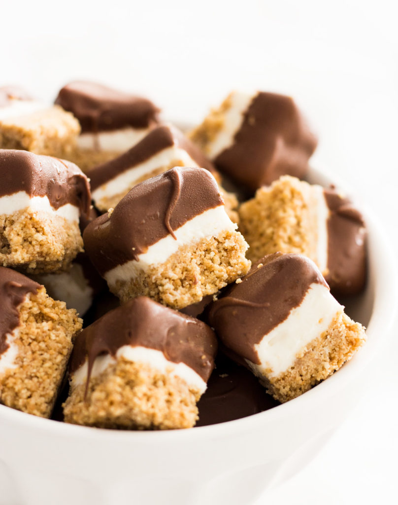 Treat yourself with this Chocolate-Covered Mini No-Bake Cheesecake Bites recipe! A mini dessert that's perfectly-portioned for snacking. Follow along with the cheesecake bites video to make this cheat day dessert!