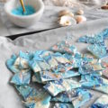 Adorned with edible glitter and luster dust, this Magical Mermaid Chocolate Bark will be a hit at any party. Adored by the kids and the kids at heart, everyone needs more color in their life!
