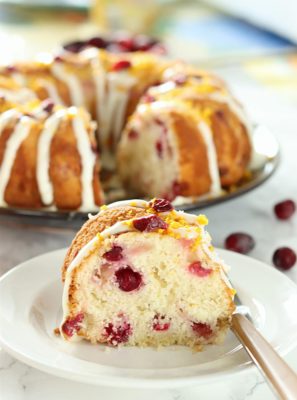 Celebrate fall with this moist, tender White Chocolate Orange Cranberry Cake. Flavored with fresh orange zest and studded with fresh red cranberries, it’s the perfect balance of sweet and tart flavors with a white chocolate glaze!
