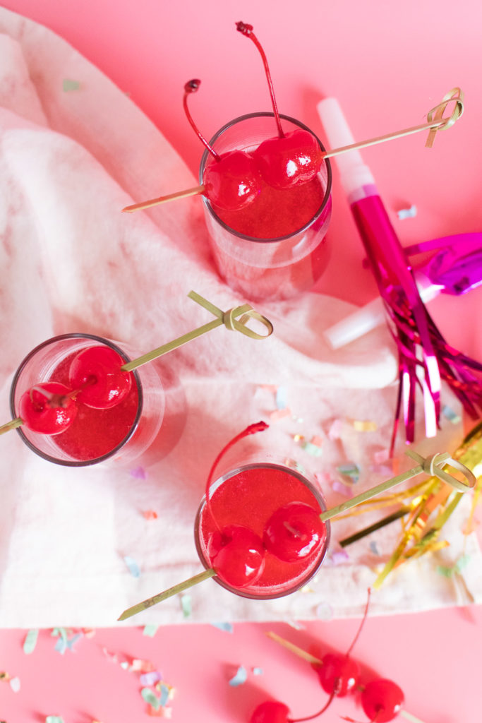 Ring in the new year with this Swirled Cranberry Champagne Cocktail made with grenadine, cranberry juice, and champagne that swirls and shines thanks to a secret ingredient!