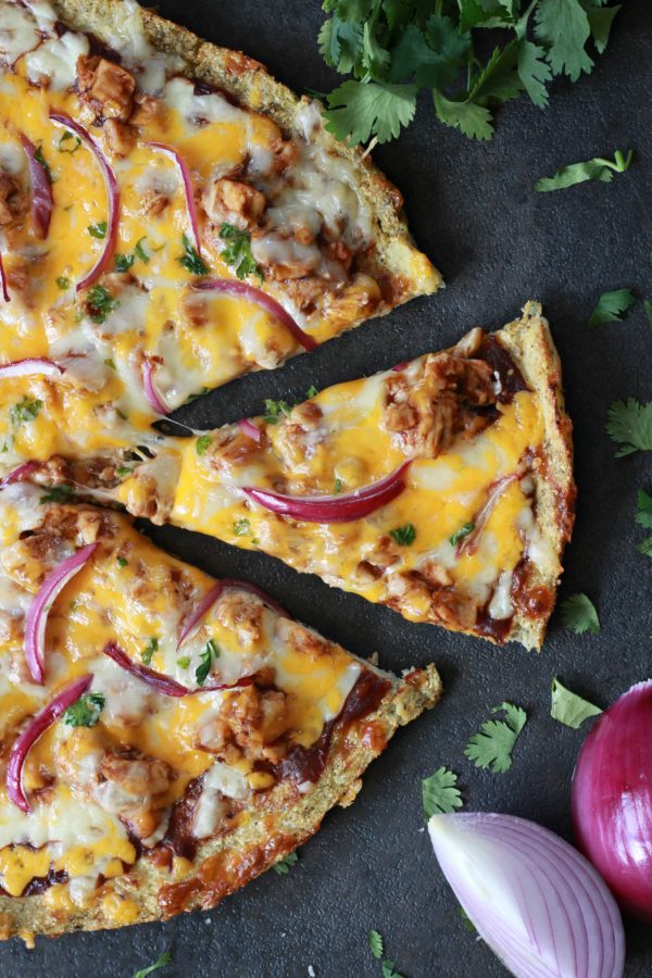 Friday night just got way more exciting. This BBQ Chicken Cauliflower Pizza will melt in your mouth, and who would've guessed that this easy dinner option is low carb, low sugar, and gluten free?!