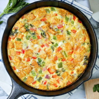 Want to be a brunch hero? Serve this Savory Smoked Gouda Veggie Frittata to truly impress your friends! So simple to make, it's perfect for Sunday brunch, lazy weekends, and family meals. {Recipe card and video included.}