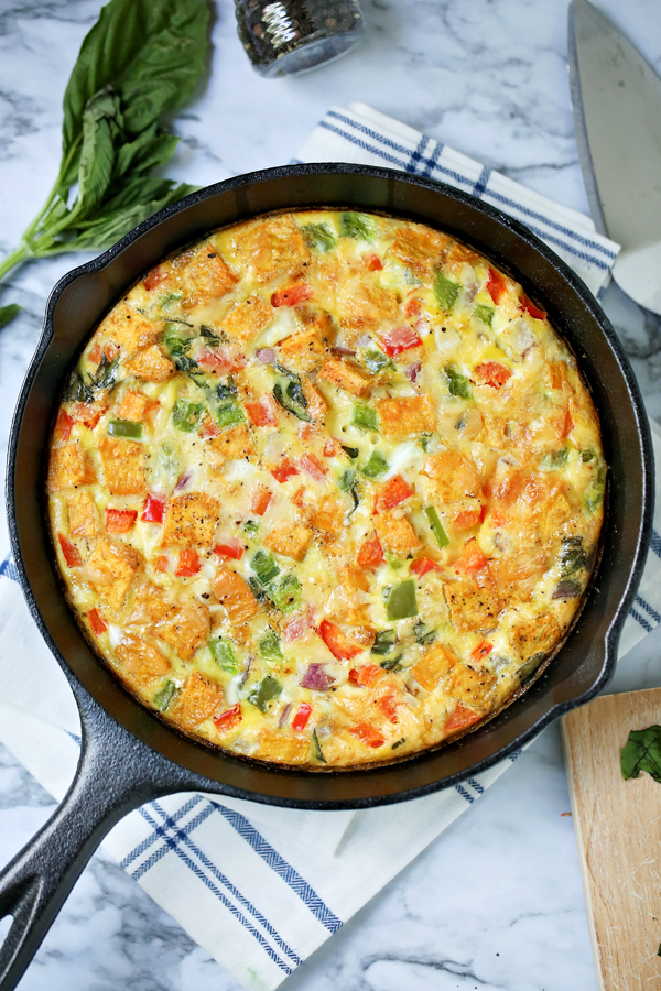 Want to be a brunch hero? Serve this Savory Smoked Gouda Veggie Frittata to truly impress your friends! So simple to make, it's perfect for Sunday brunch, lazy weekends, and family meals.