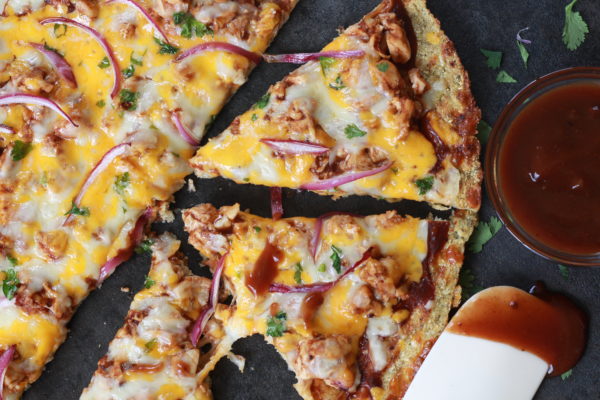 Friday night just got way more exciting. This BBQ Chicken Cauliflower Pizza will melt in your mouth, and who would've guessed that this easy dinner option is low carb, low sugar, and gluten free?!