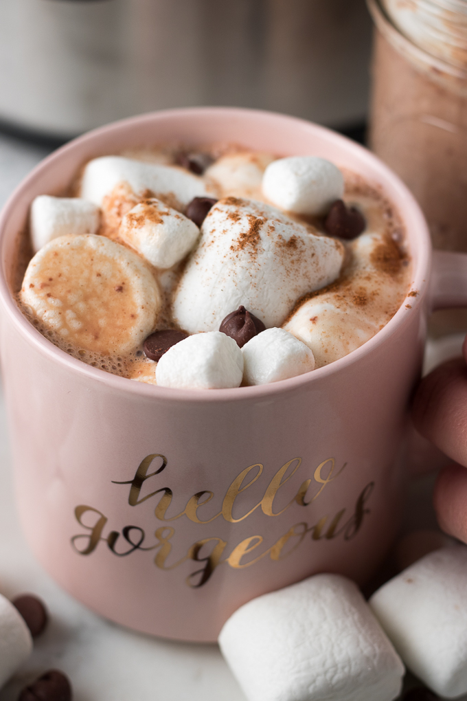 This Slow Cooker Hot Chocolate recipe is creamy, dreamy, chocolate-y, and perfect for sharing with family and friends. Customize a mug by topping it with marshmallows, cinnamon, whipped cream, or chocolate candies!