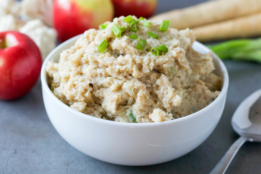 This dairy-free Roasted Cauliflower Parsnip Apple Mash made with less than 10 ingredients is the gluten-free side dish you need on your holiday menu instead of boring mashed potatoes.