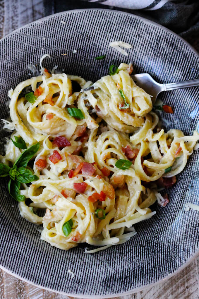This indulgent Three Cheese Fettuccine with Bacon is the perfect cheat day meal! Creamy, velvety, and delicious, this meal comes together in less than 30 minutes and the taste is simply out of this world!