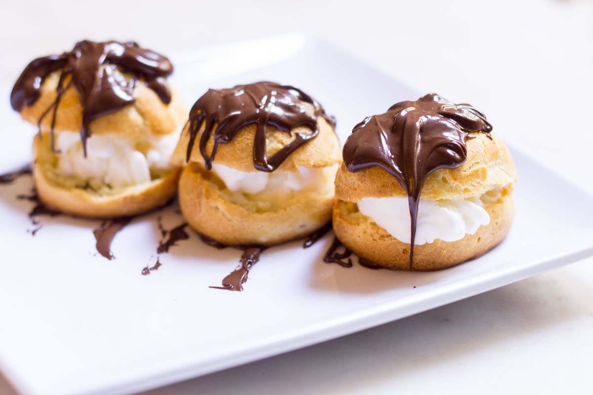 Have you ever tried French Cream Puffs? Profiteroles, as they're called in France, aren't your ordinary cream puffs. Filled with ice cream and doused in warm chocolate sauce, there is nothing more irresistibly indulgent!