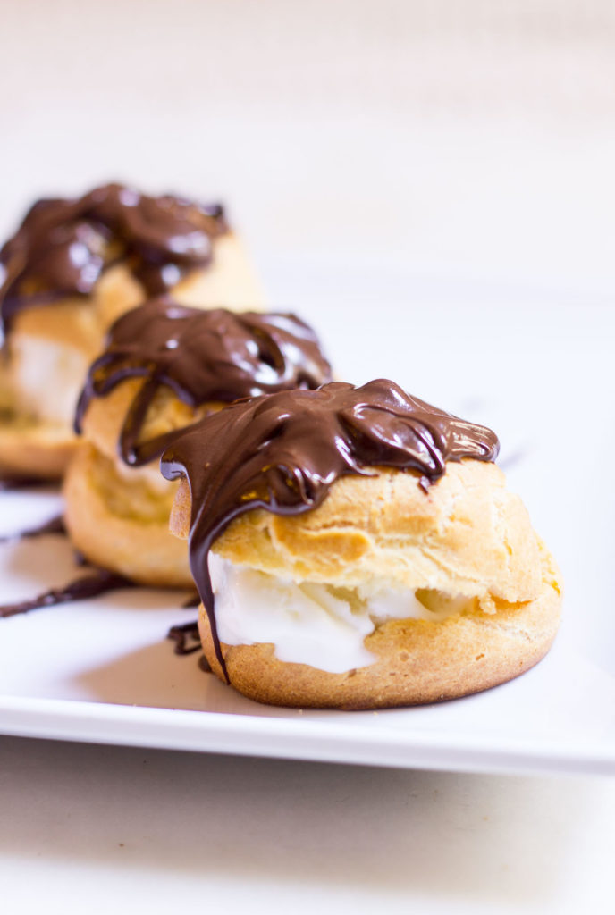 Have you ever tried French Cream Puffs? Profiteroles, as they're called in France, aren't your ordinary cream puffs. Filled with ice cream and doused in warm chocolate sauce, there is nothing more irresistibly indulgent!