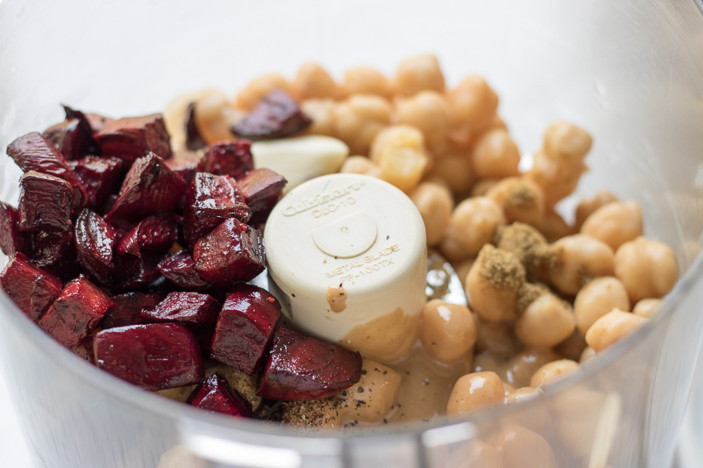This easy Roasted Beet Hummus recipe has seasonal, freshly roasted beets, warm cumin, tahini, and chickpeas. Enjoy this appetizer with your favorite chips or pita bread and don't forget to share!