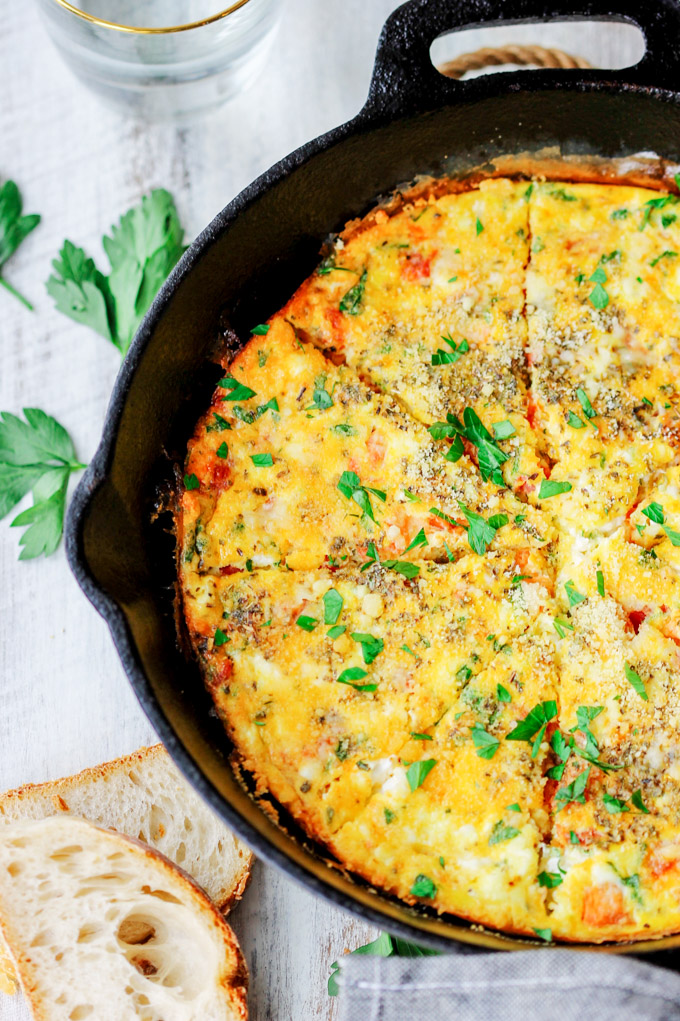 Parmesan Feta Tomatoes Frittata is a 30-minute brunch meal perfect any time of day. This one-pan meal is an egg-based comfort food that will impress guests!