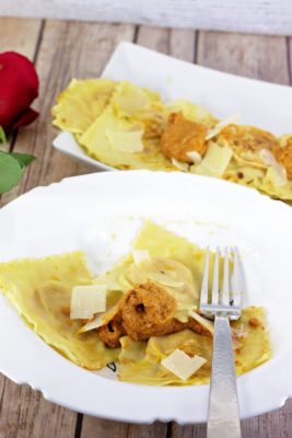Make date night extra special with this Homemade Butternut Squash Ravioli served with Romesco Sauce. The time you take making it together in the kitchen is just as magical and memorable as the meal itself!
