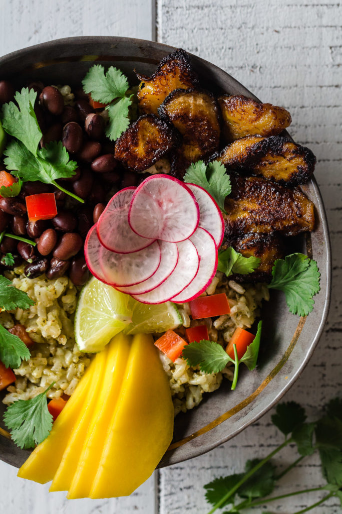 A 30-minute meal, these Crispy Plantain Black Bean Rice Bowls are the perfect healthy weeknight dinner. This gluten-free recipe is easily adaptable for a meat eater, vegan, or vegetarian dish.