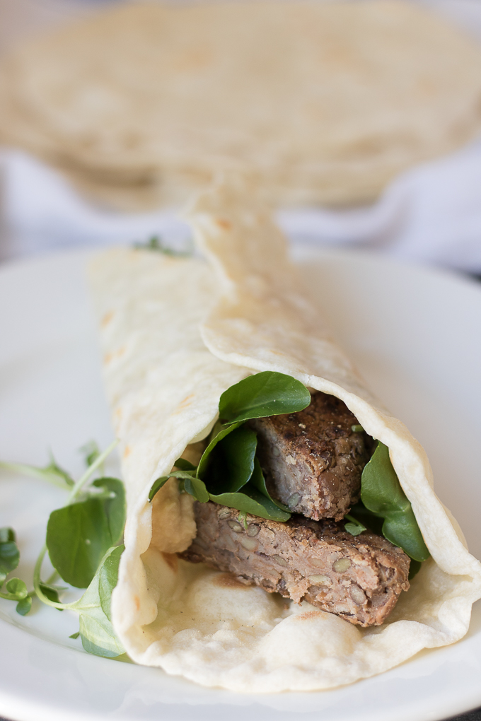 These Lentil Burger Wraps are a simple weeknight meal that's ready in about 30 minutes. A vegetarian burger with hummus and watercress is wrapped in a flour tortilla. This healthier classic is filling, delicious, and economical!