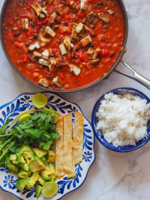 Mexican Chicken Gumbo is packed with flavor and served topped with avocado, cilantro, lime juice, and tortilla strips. The perfect 30-minute weeknight dinner or tailgating food, this budget-friendly dish is a one-pot meal everyone will love!