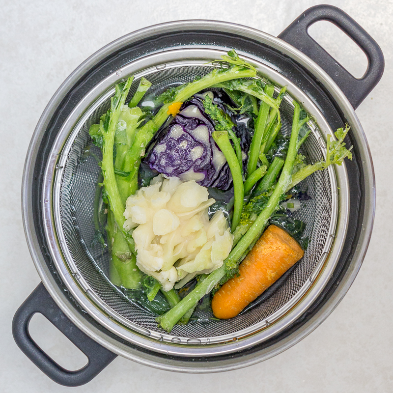 This simple kitchen hack will show you how to make Homemade Veggie Broth with kitchen scraps. A versatile stock base that eliminates waste in the kitchen and saves you money is simpler than you think to make at home!
