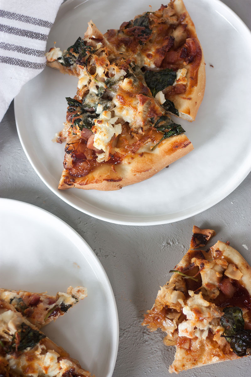 This homemade Bacon-Onion BBQ Chicken Pizza is a restaurant-style meal made affordably at home. If you forego the made-from-scratch pizza dough and use store bought instead, this is a budget-friendly, 30-minute meal perfect for busy weeknights!