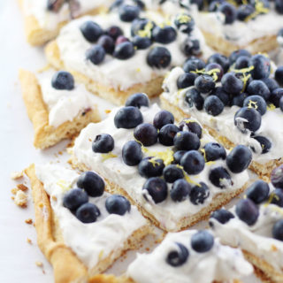 This irresistible Blueberry Cheesecake Dessert Pizza is a semi-homemade dessert recipe that uses only six ingredients and is ready in 30 minutes. Mounds of fresh blueberries are nested in a pillow of no-bake cheesecake fluff over a crescent roll crust.