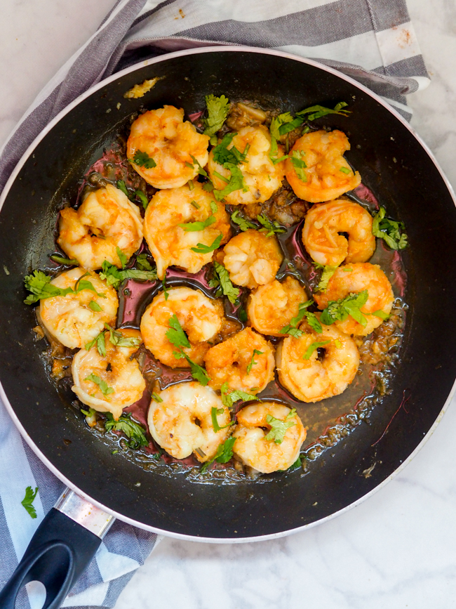 This Pan Fried Honey Garlic Shrimp is a 6-ingredient dinner that takes minutes to make. Both gluten free and dairy free, this one-pan meal is a perfect busy weeknight dinner served over rice or party appetizer on its own!