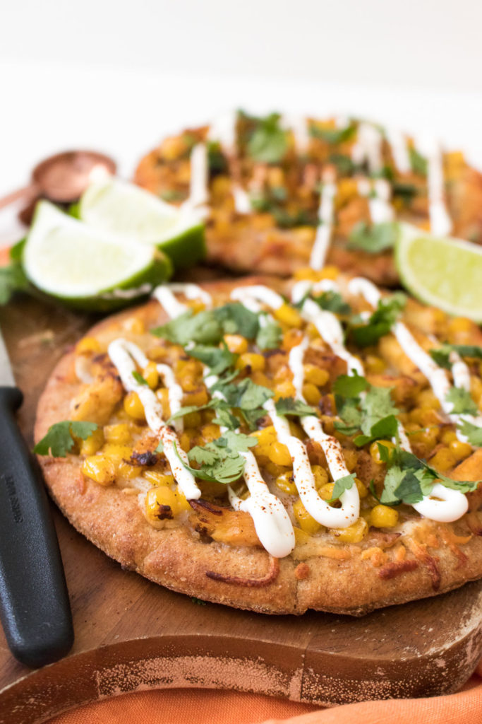 These personal-sized Spicy Chicken Street Corn Pita Pizzas are perfect if you're cooking for two. Inspired by the flavors of Mexican Street Corn, this semi-homemade, 30-minute meal is perfect for date night!