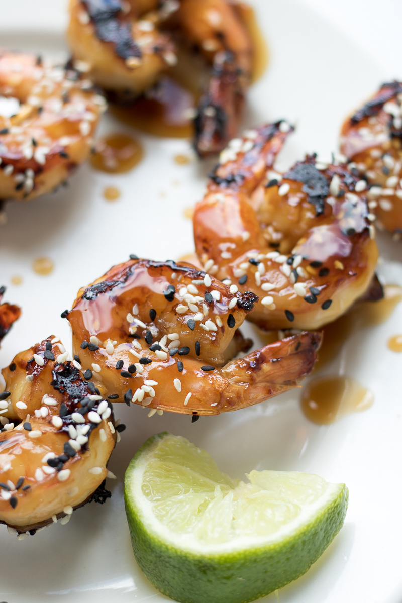 This Grilled Teriyaki Sesame Shrimp uses fresh jumbo shrimp and a homemade teriyaki sauce. It's perfect as an appetizer for outdoor entertaining or on its own over rice as a weeknight meal. This shrimp on a stick is finger-licking good!
