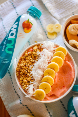 Loaded with strawberries, bananas, peaches, and all of your favorite toppings, this simple and healthy Banana Strawberry Smoothie Bowl is a kid-friendly breakfast that takes minutes to make, but it's impressive enough to serve at a Sunday Brunch!