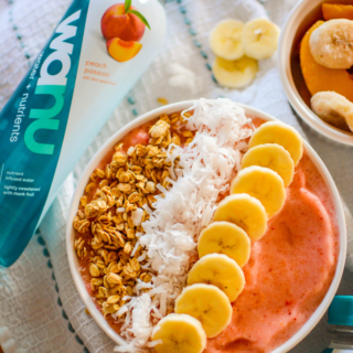 Loaded with strawberries, bananas, peaches, and all of your favorite toppings, this simple and healthy Banana Strawberry Smoothie Bowl is a kid-friendly breakfast that takes minutes to make, but it's impressive enough to serve at a Sunday Brunch!